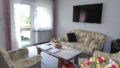 Wohnzimmer mit Balkon EG