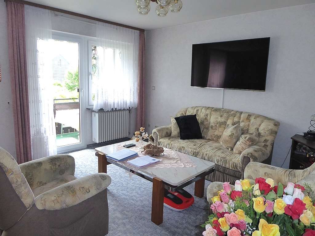 Wohnzimmer mit Balkon EG
